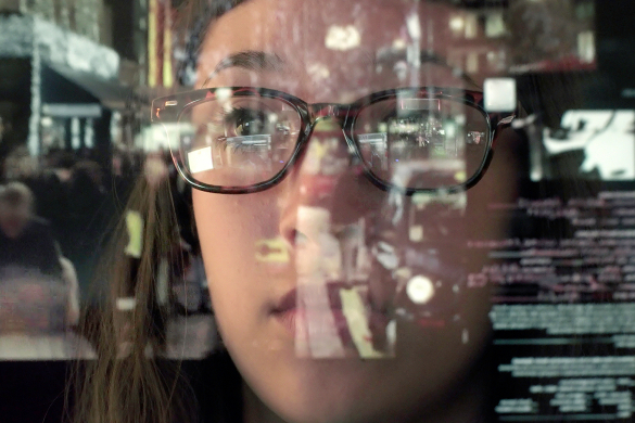woman staring thru glass screen