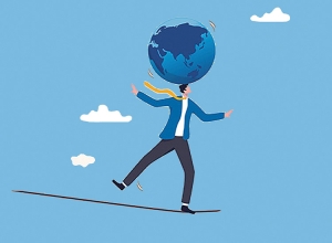 man balancing with globe on his head